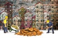 Construction site concept with miniatures of construction workers against Royalty Free Stock Photo