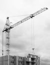 Construction site. Construction cranes and apartment building un Royalty Free Stock Photo