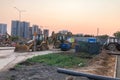 Construction site. construction equipment in bright colors stands on the site next to the construction site. excavators, Royalty Free Stock Photo