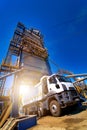 Construction site. Construction of a plant for the production of asphalt. Blue sky background. Royalty Free Stock Photo