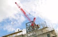 Construction site with crane against blue sky,UK.