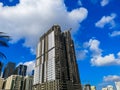 Construction site, crane and big building under construction against blue cloudy sky Royalty Free Stock Photo