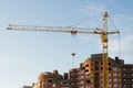 Construction site and a crane with a blue sky in the morning at sunrise Royalty Free Stock Photo