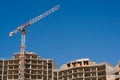 Construction site and a crane with a blue sky Royalty Free Stock Photo