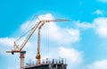 Construction site with crane and building. Real estate industry. Crane use reel lift up equipment in construction site. Building Royalty Free Stock Photo