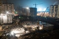 Construction site with crane columns at night Royalty Free Stock Photo