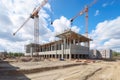 construction site with crane lifting concrete blocks in the air Royalty Free Stock Photo