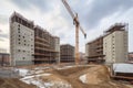 construction site with crane lifting heavy concrete blocks, for building projects