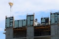 Construction site with crane and man works