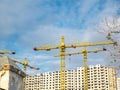Construction site with cranes against the sky Royalty Free Stock Photo