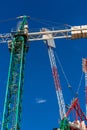 Construction site with cranes, blue sky on the background Royalty Free Stock Photo