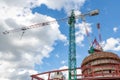 Construction site with cranes, blue sky on the background Royalty Free Stock Photo