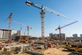 Construction site with cranes and blue sky Royalty Free Stock Photo