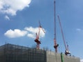 Construction site with cranes with blue sky. Royalty Free Stock Photo