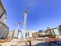 Construction site with cranes building new house