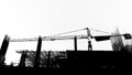 Construction site with cranes on silhouette background Royalty Free Stock Photo