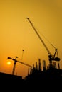 Construction site with cranes on silhouette background Royalty Free Stock Photo