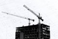 Construction site with cranes on silhouette background Royalty Free Stock Photo