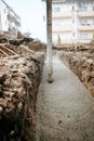 Construction site details - concrete pump, automatic pipe pump working and pouring fresh cement Royalty Free Stock Photo