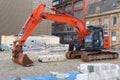 Construction site digger during excavation on building site in city centre Royalty Free Stock Photo