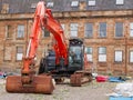 Construction site digger during excavation on building site in city centre Royalty Free Stock Photo