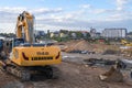 Construction site during earthmoving works with a new excavator in the foreground. Heidelberg, Germany - October 3 2017. Royalty Free Stock Photo