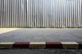 The construction site metal fence build beside the street footpath Royalty Free Stock Photo