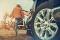 Construction Site Equipment and the Business Owner Next to His Truck Royalty Free Stock Photo