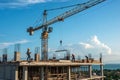 Crane and building construction site with blue sky Royalty Free Stock Photo