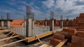 Construction Site Foundation with Concrete Pillars and Rebar Showing Progress of New Building Development under Cloudy Blue Sky Royalty Free Stock Photo