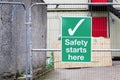 Construction site health and safety message rules sign board signage on fence boundary Royalty Free Stock Photo