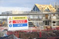 Construction site health and safety message rules sign board signage on fence boundary Royalty Free Stock Photo