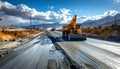Construction Site with Heavy Machinery and Mountain Backdrop Royalty Free Stock Photo