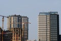 Construction site. High-rise multi-storey buildings are being built. Tower cranes near buildings. Industrial background Royalty Free Stock Photo