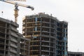 Construction site. High-rise multi-storey buildings are being built. Tower cranes near buildings. Industrial background Royalty Free Stock Photo