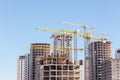 Construction site with high-rise unfinished apartment building a Royalty Free Stock Photo