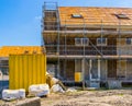 Construction site with house in scaffolding, building of a new neighborhood, Rucphen, The Netherlands, 6 may, 2022