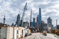 Construction site with houses and a construction crane on the background of skyscrapers of Shanghai Royalty Free Stock Photo