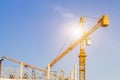 A construction site including several cranes working on a building, Boom crane on the construction of a high-rise and scaffolding Royalty Free Stock Photo