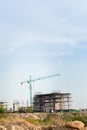 Construction site including several cranes working on a building complex. Royalty Free Stock Photo