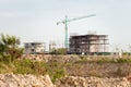 construction site including several cranes working on a building complex. Royalty Free Stock Photo