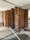 Construction site, industrial under construction empty space, red brick wall, architectural ground work tools, work in progress Royalty Free Stock Photo