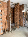 Construction site, industrial under construction empty space, red brick wall, architectural ground work tools, work in progress Royalty Free Stock Photo