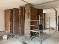 Construction site, industrial under construction empty space, red brick wall, architectural ground work tools, work in progress Royalty Free Stock Photo