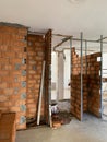 Construction site, industrial under construction empty space, red brick wall, architectural ground work tools, work in progress Royalty Free Stock Photo