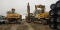 Construction site . Large crawler excavators parked after a day\'s work.