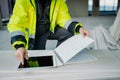 Construction site manager using digital tablet to inspect building progress. Royalty Free Stock Photo