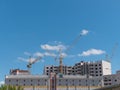 Construction site with many cranes against the sky