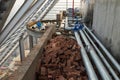 Construction site with metal water pipes, brick... in mess Royalty Free Stock Photo