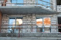 The construction site of a multi-storey residential building made of white brick against a blue sky background. View of the new Royalty Free Stock Photo